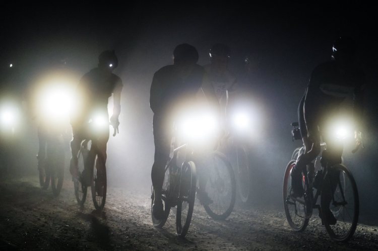 Gravel cyclists racing in the dark